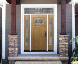 Light wood front entry door installed on a home.