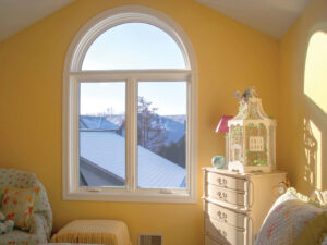 Arched house window in a bedroom.