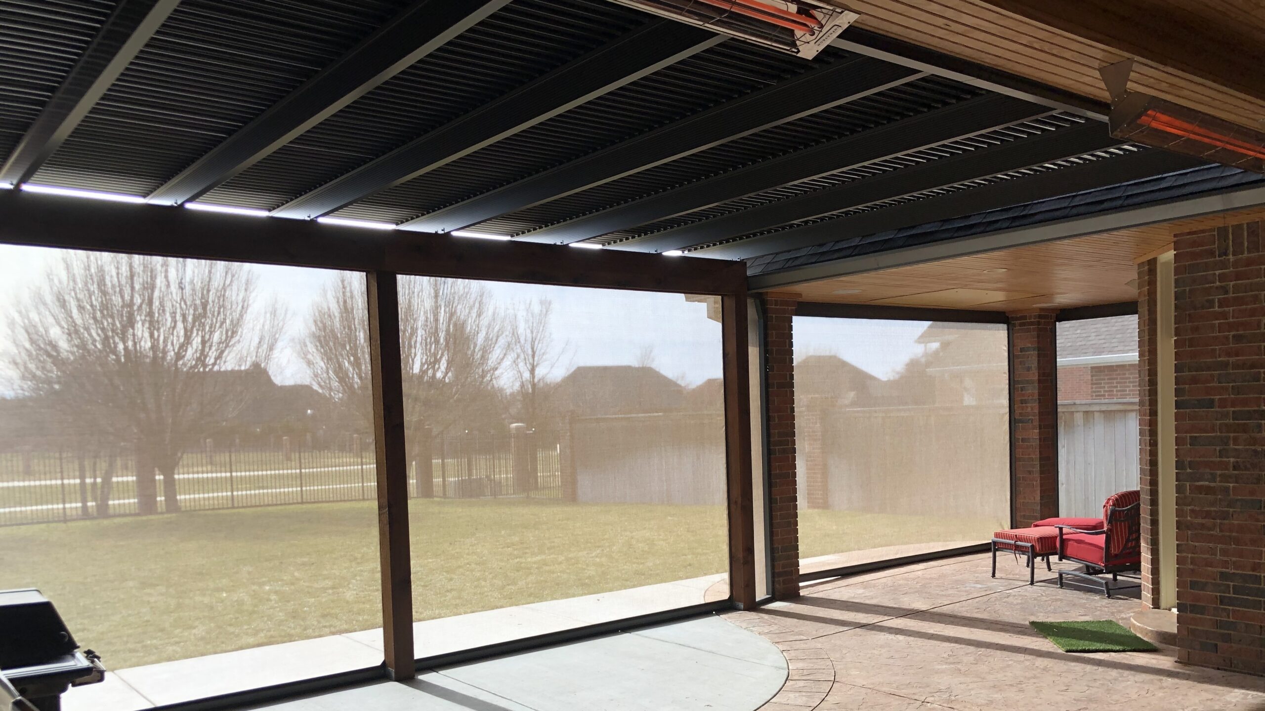 The view under a retractable awning over a patio