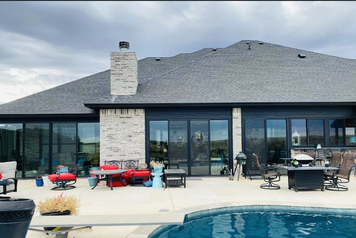 Patio enclosure and split sliding patio doors installed by Amarillo Solar Shade Co. for a home in the Texas Panhandle.