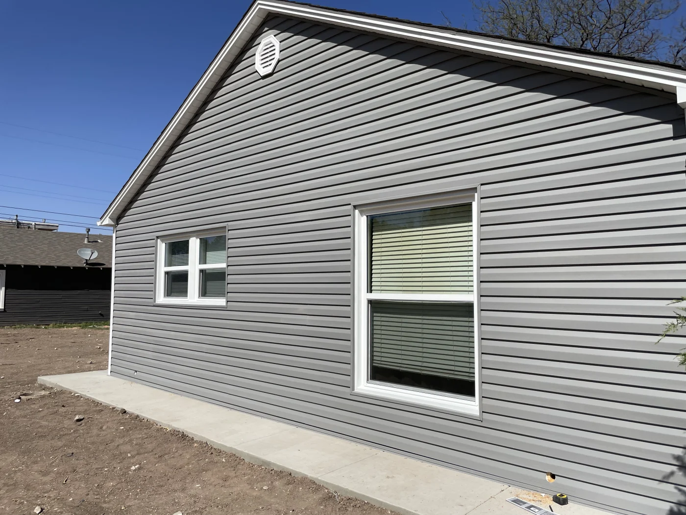 Vinyl siding from ProVia installed by Amarillo Solar Shade Co. for a home in the Texas Panhandle.